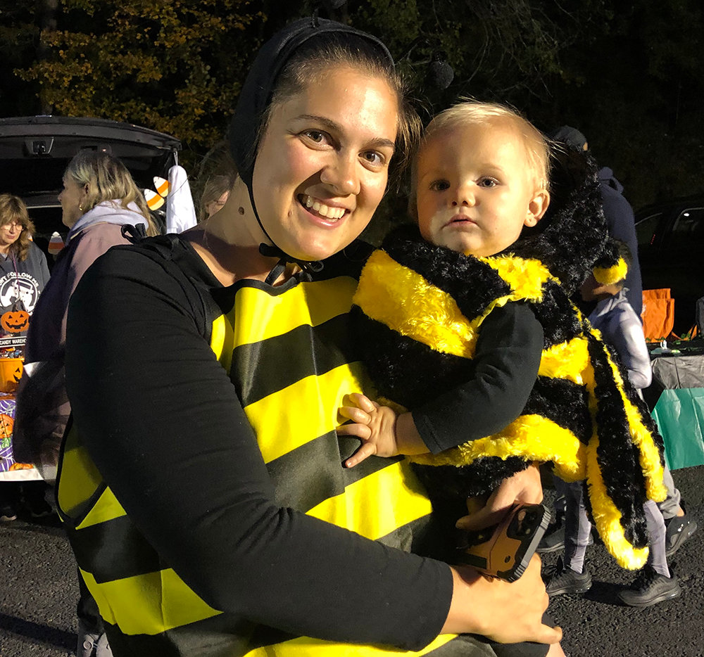 Emily and daughter Natalie Reppert enjoy all the buzz of the Trunk-or-Treat festivities.